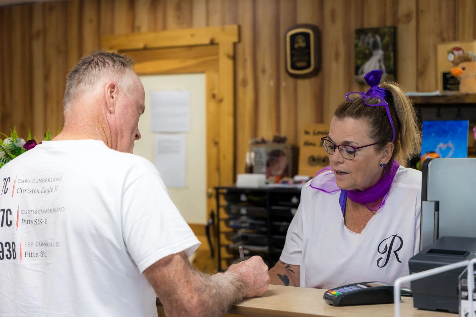 The campground team behind the camp store counter during 50's Weekend
